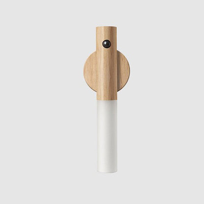 Wooden and cylindrical magnetic motion sensor light on a light gray background
