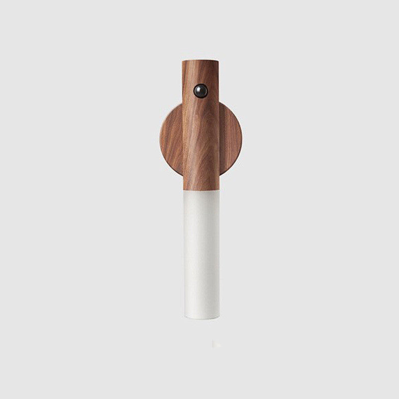 Wooden and cylindrical walnut magnetic motion sensor light on a light gray background