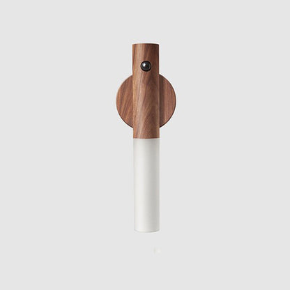 Wooden and cylindrical walnut magnetic motion sensor light on a light gray background