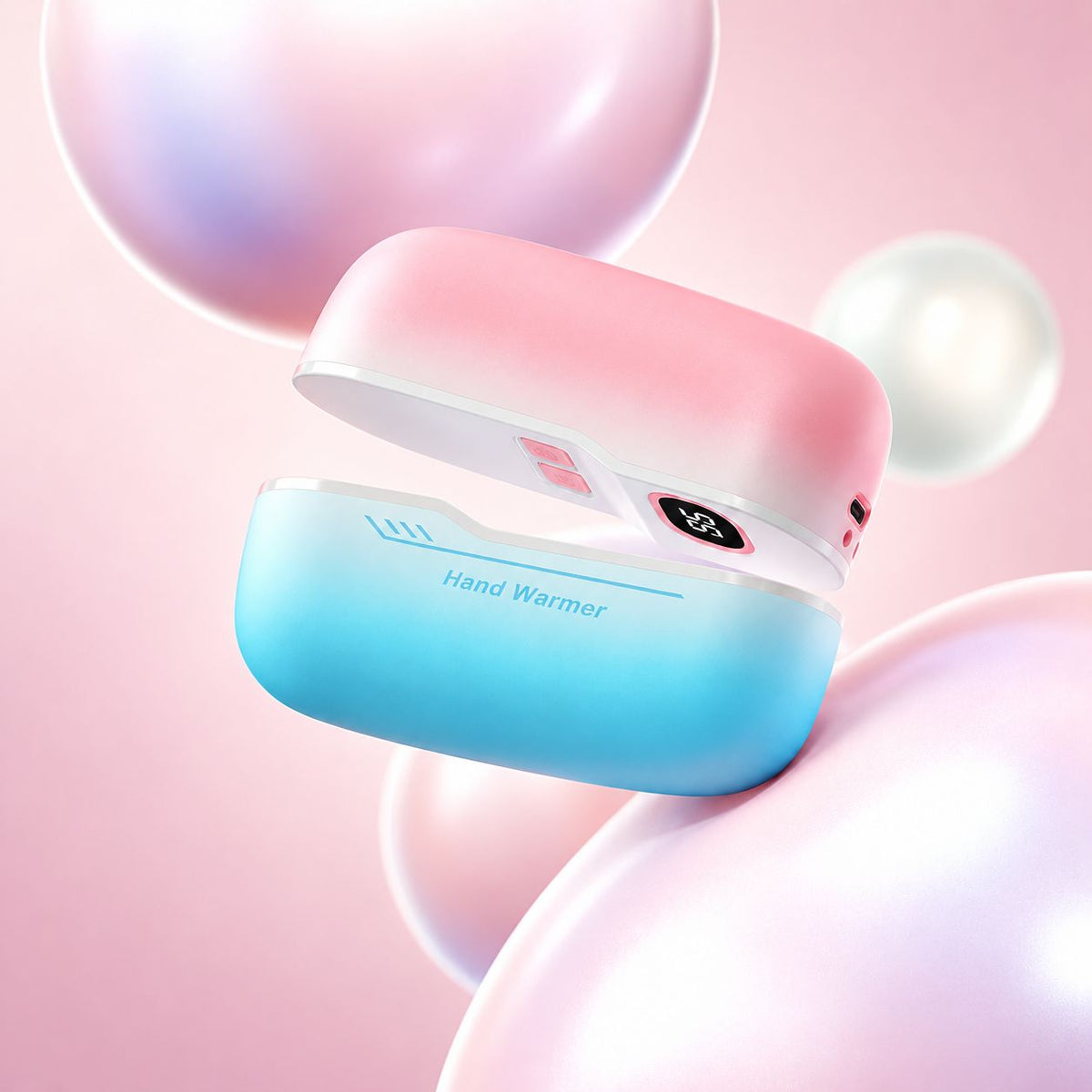 Blush and sky blue rechargeable magnetic hand warmer in a pastel setting