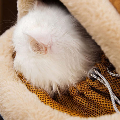 Cat resting comfortably inside a soft plush pet carrier