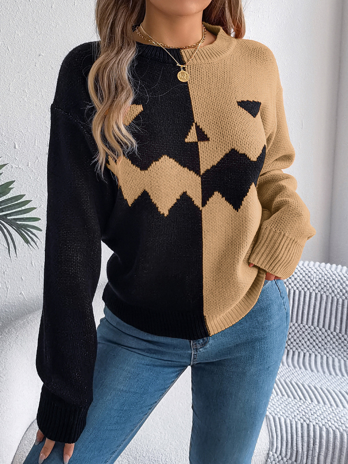 Tan pumpkin sweater worn casually
