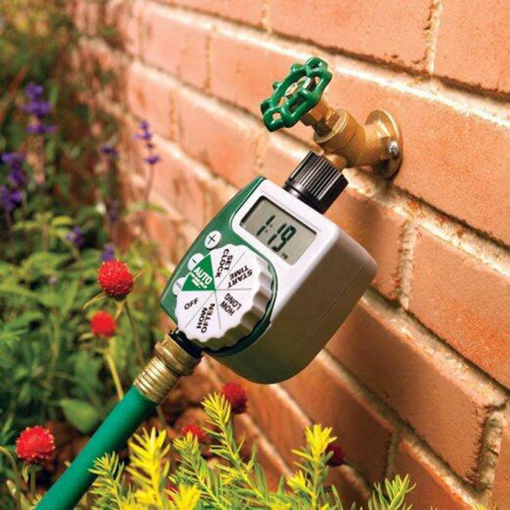 Digital garden water timer connected to an outdoor faucet and garden hose