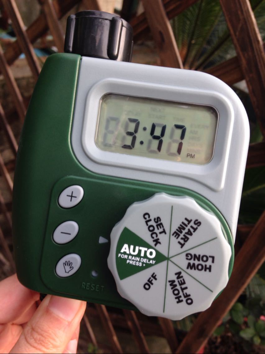 Digital garden water timer showing LCD display and easy-to-use control dial