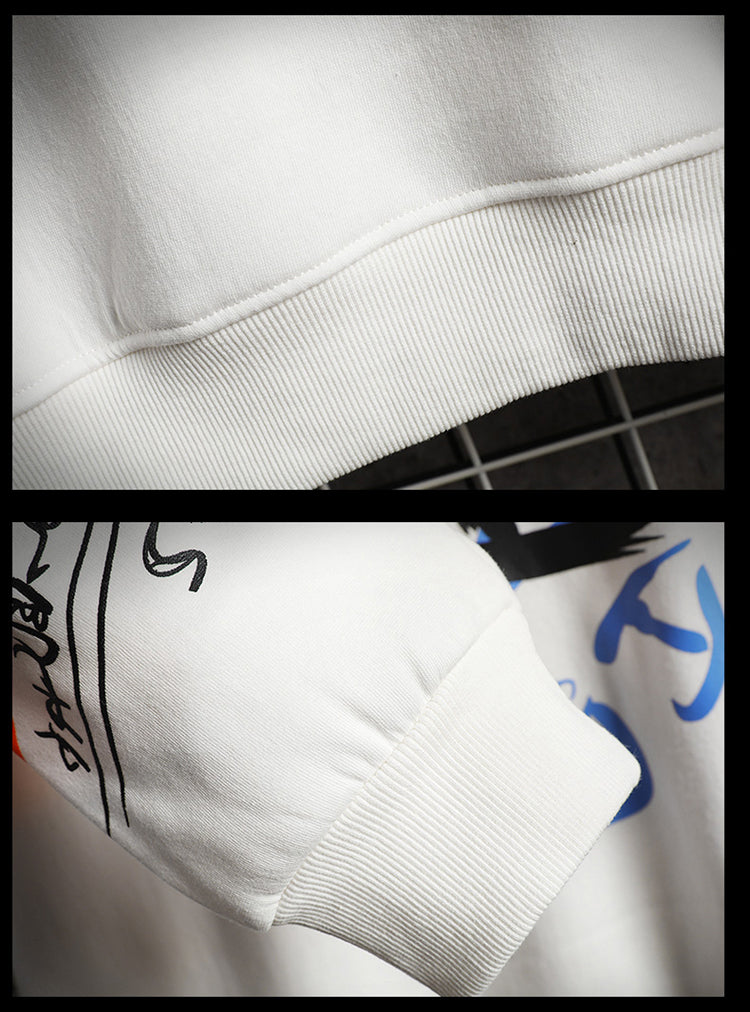 Close-up detail of soft fabric and colorful graffiti print on oversized sweatshirt