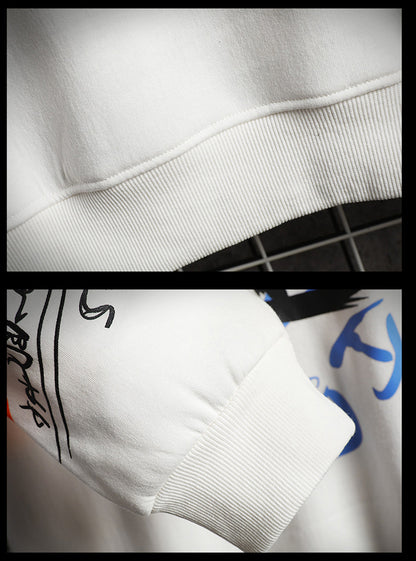 Close-up detail of soft fabric and colorful graffiti print on oversized sweatshirt
