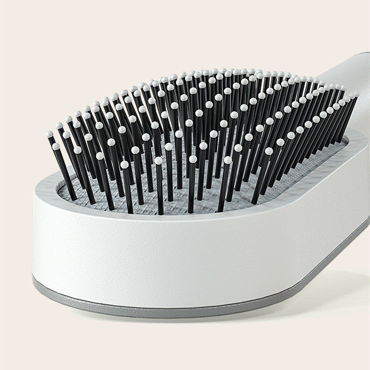 Close-up of hair brush showing flexible detangling bristles