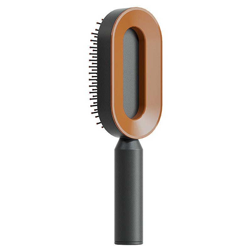 Self-cleaning hair brush in gold with scalp massage bristles