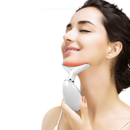 Woman using an LED facial and neck massager as part of her skincare routine
