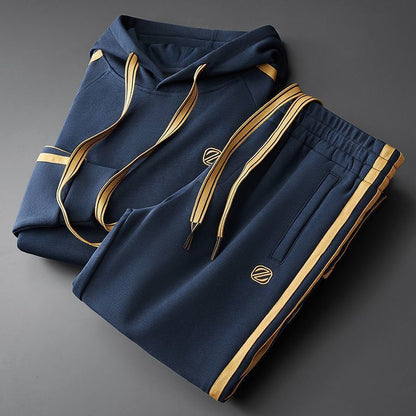 Men's hooded two-piece tracksuit set in midnight blue with gold contrast details