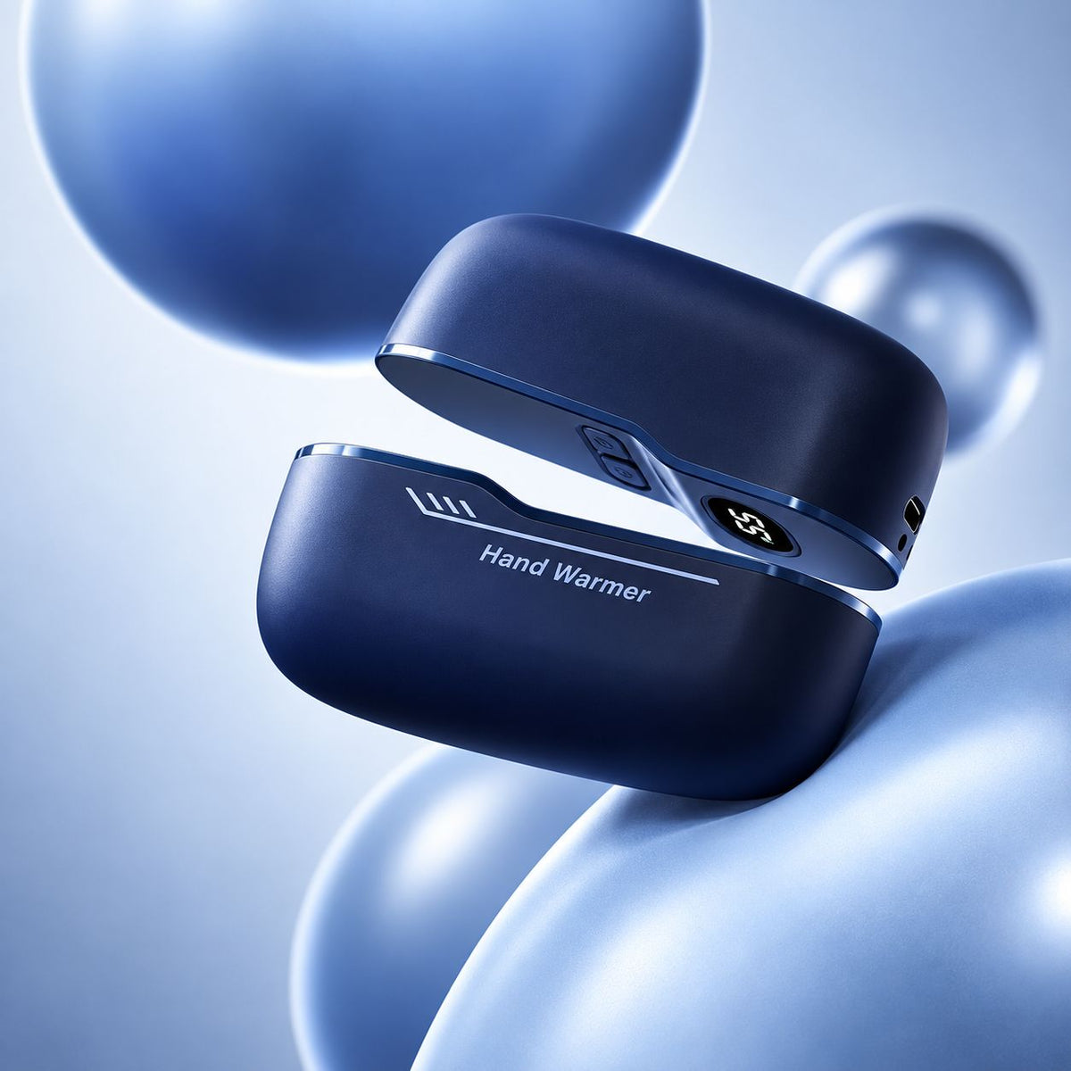 Midnight blue rechargeable magnetic hand warmer shown open