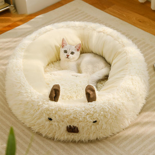 Plush cat bed with raised sides and a soft cushioned interior