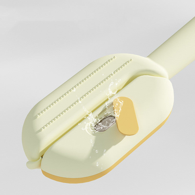 Self-cleaning pet brush being cleaned after grooming