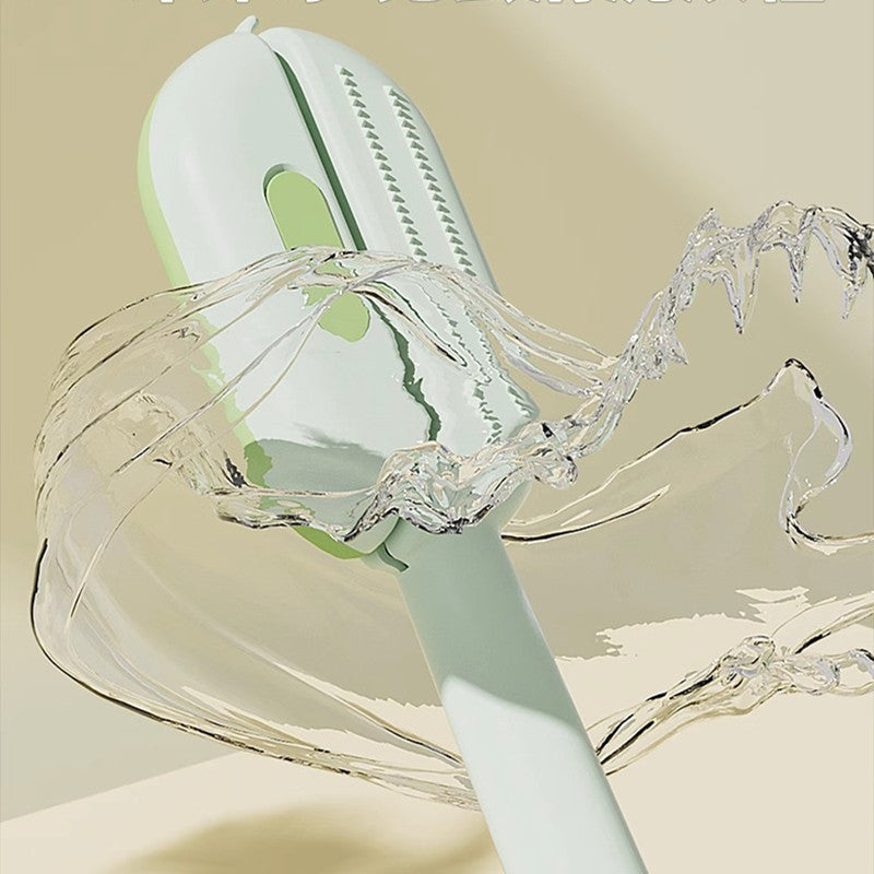 Self-cleaning pet brush being rinsed with water