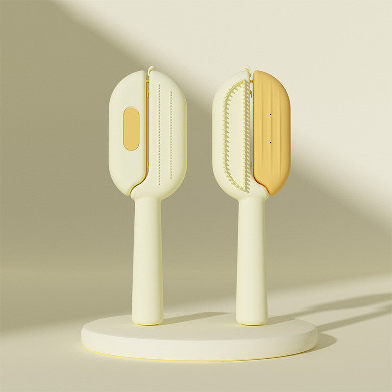 Yellow self-cleaning pet brush with grooming bristles