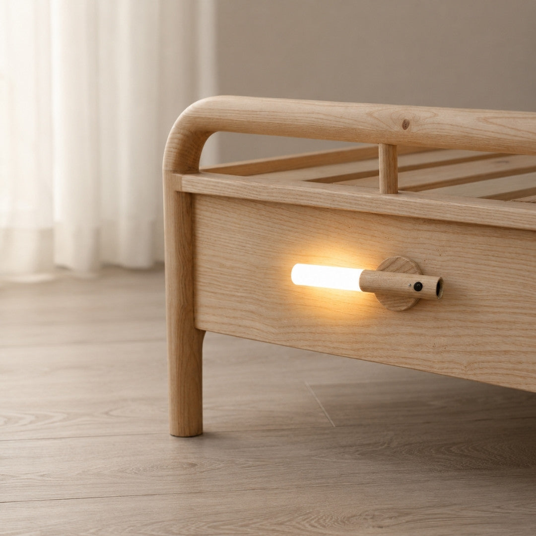 Motion Sensor Night Light providing soft warm lighting beside a bed
