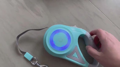Retractable dog leash demonstration showing the LED spotlight, retractable mechanism, and one-handed control