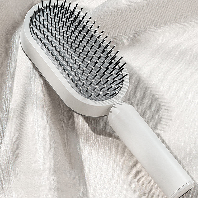 Hair brush with flexible bristles for gentle scalp massage