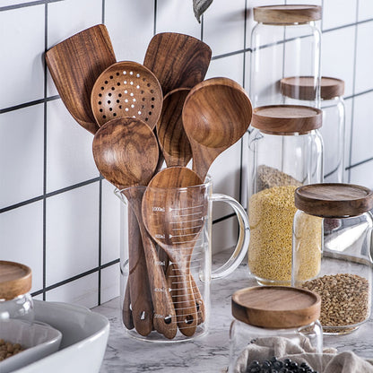 Teak wood kitchen utensils displayed in a kitchen storage holder